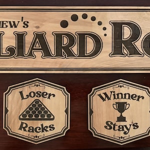 May include: Wooden billiard room sign with the name "Matthew's" and the text "Billiard Room Since 2026". Below are four wooden plaques with billiard-themed phrases: "Call Your Shots", "Loser Racks", "Winner Stays", and "Respect The Felt".