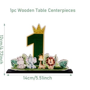 May include: A wooden table centerpiece featuring a dark green number one topped with a gold glitter crown, surrounded by illustrations of a hippo, elephant, giraffe, and lion. The item measures 4.72 inches in height and 5.51 inches in width.