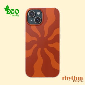 May include: A phone case with a red and orange sunburst design. The case is made of a clear material with a textured finish. The case is compatible with iPhone models.