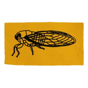 May include: A black and white illustration of a cicada on a yellow background.