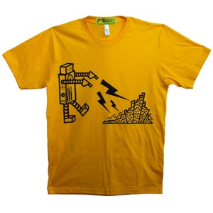 Könnte beinhalten: Ein gelbes T-Shirt mit einem schwarzen Roboter-Motiv, der einen Blitz hält und eine Stadt zerstört.