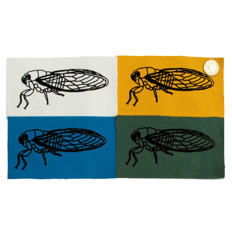 May include: Four fabric squares with a black silhouette of a cicada on each. The squares are white, yellow, blue, and green.
