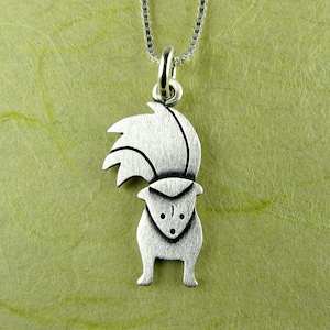 Tiny skunk pendant / necklace - sterling silver