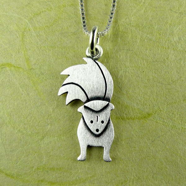 Tiny skunk pendant / necklace - sterling silver