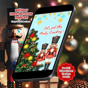 May include: A smartphone displaying a digital birthday video invitation template featuring two nutcracker figures, a decorated Christmas tree, and the text "Let's get this Party Cracking!" next to a physical wooden nutcracker figurine.
