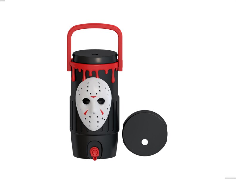 May include: A black cylindrical beverage dispenser with a red handle and a red spigot at the base. The exterior features a white hockey-style mask with red accents and a red drip pattern at the top. A separate black circular lid is placed to the right.