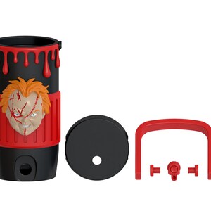 May include: A black cylindrical tumbler featuring a red silicone sleeve with a sculpted Chucky doll face, red dripping paint accents at the top, a black lid with a straw hole, and a detachable red handle with small red connector components.