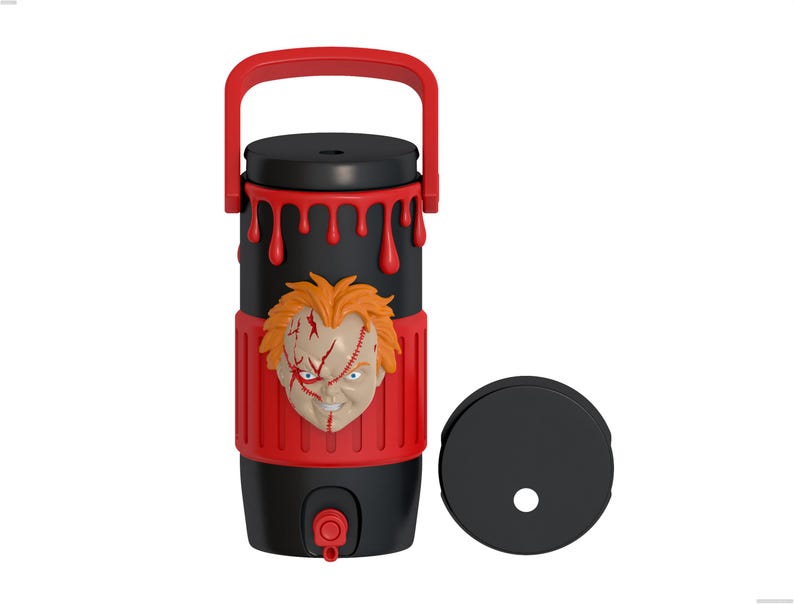 May include: A black and red cylindrical beverage container featuring a molded 3D face of a character with orange hair and facial scars. The top section has a red handle and red dripping paint details. A separate black circular lid is placed to the right.