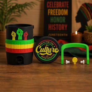 May include: A black cylindrical container with a green, yellow, and red band, featuring raised fist icons. A matching black lid displays the text DO IT FOR THE CULTURE JUNETEENTH. A green handle and small white and yellow plastic components are included.