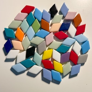 May include: A collection of colourful diamond-shaped mosaic tiles in various shades of blue, green, red, yellow, orange, and white.