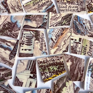May include: A collection of broken ceramic tiles with vintage illustrations of Oregon landmarks and cityscapes. The tiles display text including "State Salem", "Highway", and "Hood from Portland". The color palette includes beige, brown, blue, and green.