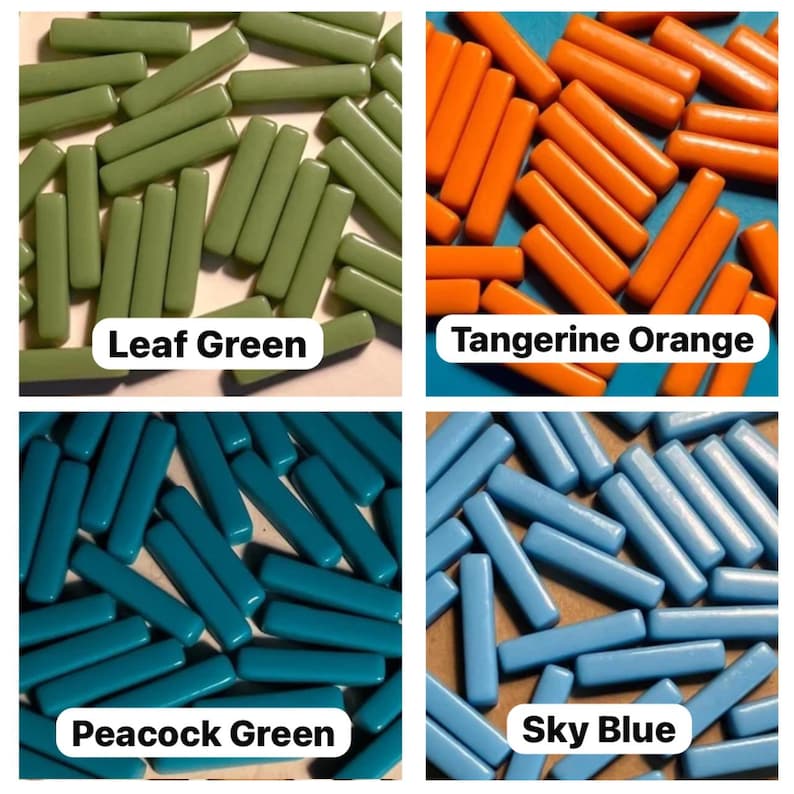 May include: Assortment of glass tiles in four colors: leaf green, tangerine orange, peacock green, and sky blue. The tiles are rectangular and have a glossy finish.