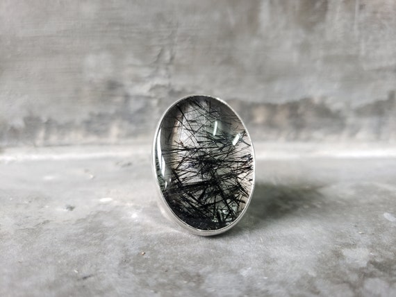 Oval Rutilated Quartz On A Silver Band