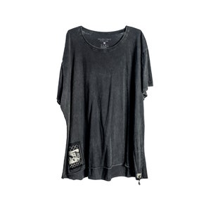 May include: A black t-shirt with a distressed look and a small pocket on the left side. The pocket has a black and white graphic of a person's face with a chain link design. The t-shirt has a round neckline and short sleeves.