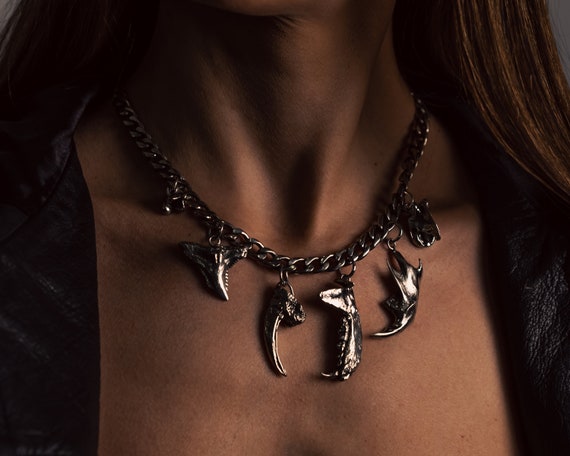 Object2 Remanent Charm Necklace with jaw bones, raptor claw, sharks tooth and  snake vertebrae on Cuban Chain Link Curb Silver Choker