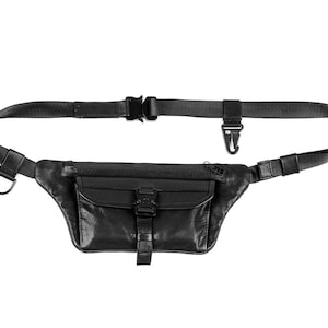 May include: A black leather fanny pack with a zippered pocket and an adjustable strap. The strap has a clip closure.
