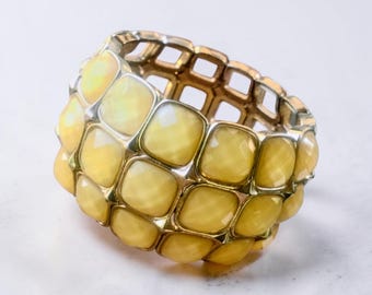 Bracciale rigido spesso giallo elasticizzato, gioiello vintage di bigiotteria
