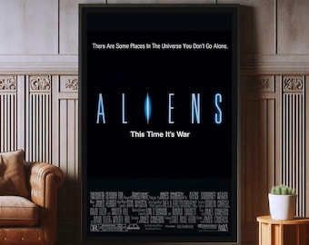 May include: Framed movie poster for the film "Aliens." The title is in a glowing blue font against a black background, with the tagline "This Time It's War." The poster is in a black frame and is displayed in a room with wood paneling.