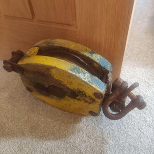 Vintage heavy wood and steel pulley possibly from a ship