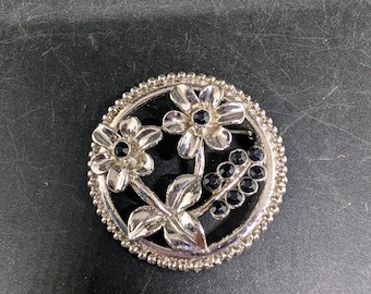 Silver Brooch with Flowers and Black Faceted Accents