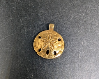Monet Gold Tone Sand Dollar Pendant