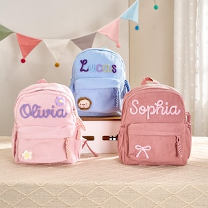 May include: A set of three ceramic mugs with a speckled, matte finish. The mugs are in shades of cream, light gray, and dark gray. Each mug has a simple, minimalist design, perfect for coffee or tea.