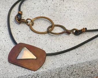 Play button Pendant - handmade copper and sterling silver on cord with clasp