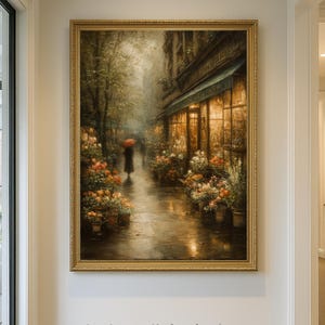 May include: A vertical wall art print featuring a rainy city street scene with a person holding a red umbrella, surrounded by flower stalls and warm glowing shop windows. The print includes the text ART PAPER &ndash; FRAME NOT INCLUDED.