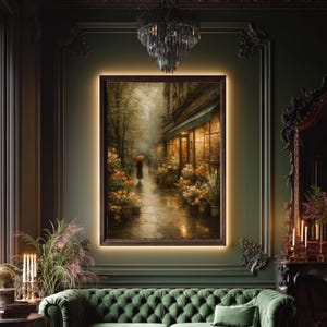 May include: A rectangular framed wall art piece depicting a rainy street scene with a person holding a red umbrella walking past a flower shop. The painting features warm golden light emanating from the shop windows against a dark, moody backdrop.