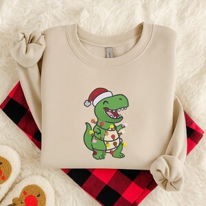 Christmas Dinosaur Sweatshirt, Embroidered T-Rex Xmas Sweater, Funny Dino Holiday Hoodie, Festive Sweatshirt, Dinosaur Shirt, Christmas Gift