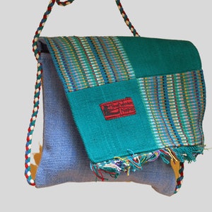 Bolso de mano tejido de algodón con flecos