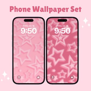 Peut inclure: Deux fonds d'écran de téléphone roses avec un motif d'étoiles blanches sur un fond rose. L'heure est 9h50 sur les deux écrans. Le texte "Vendredi 26 juillet" est affiché sur les deux écrans.