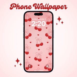 May include: A pink phone wallpaper with a pattern of red cherries and white bows. The time is 2:20 and the date is Sunday, November 3.