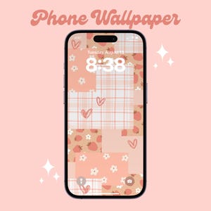 May include: A pink and white phone wallpaper with a patchwork design featuring strawberries, hearts, and plaid patterns. The phone screen displays the time 8:38 and the date Tuesday, August 15.