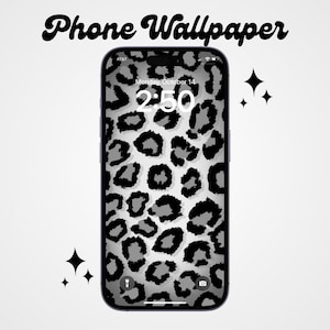 May include: A black and white leopard print phone wallpaper with a digital clock displaying 2:50. The phone screen also shows the date, Monday, October 14.