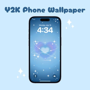 May include: A smartphone displays a Y2K-themed wallpaper with a blue gradient background. The lock screen shows the time 4:34 on Monday, July 15, with a heart-shaped design and sparkling stars. The phone is black with a silver frame.