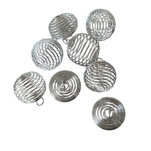 May include: A set of eight silver metal cage balls. The balls are made of wire and have a spherical shape. They are all the same size and are arranged in a random pattern.