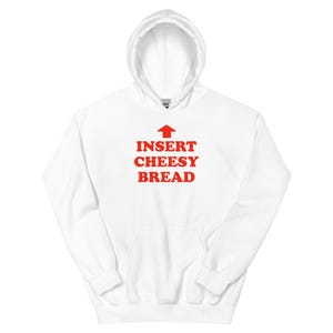 May include: White hooded sweatshirt with the text "INSERT CHEESY BREAD" in red, with a red arrow pointing upwards. The sweatshirt has a front pocket and a drawstring hood.