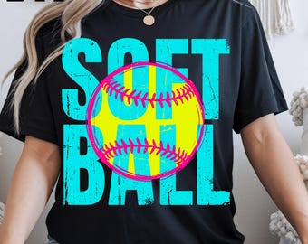 May include: A black short-sleeve t-shirt featuring the word SOFTBALL in large, distressed cyan blue letters. A bright yellow softball with a vibrant pink outline and pink stitching is centered over the text. The design has a textured appearance.