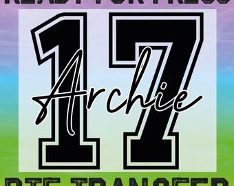 May include: A DTF transfer design featuring the name "Archie" beneath the number "17" in a black, collegiate-style font. The design is set against a gradient background with the words "READY FOR PRESS" and "DTF TRANSFER" in a distressed font.