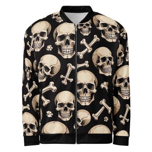 May include: Black bomber jacket featuring a repeating pattern of beige skulls and crossbones. The jacket has a full-length zipper, black cuffs, and a black hem. The skulls are detailed with shadows and highlights, creating a three-dimensional effect. The overall design has a gothic or edgy aesthetic.