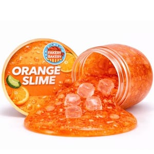 May include: A white ceramic mug with a black handle and the text "But First, Coffee" in a bold, black font. The mug is set against a blurred background, suggesting a cozy setting.