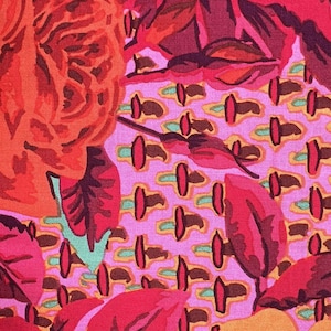May include: A fabric swatch featuring a vibrant floral pattern with large orange and red roses against a pink background with a repeating geometric stitch motif. The white selvage edge displays the text: Westminster Fibers # PWGP038 Cabbage and.