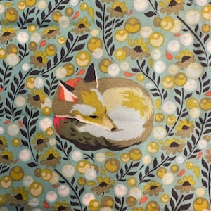 May include: A fabric pattern featuring a curled-up fox in shades of brown, yellow, and white. The fox is surrounded by a repeating pattern of yellow flowers, dark green leaves, and white bubbles on a light blue background.