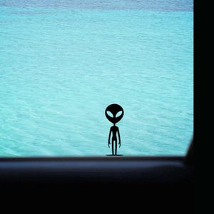 May include: A black silhouette of an alien stands against a backdrop of turquoise water. The alien figure has a large oval head with two large eyes and a slender body. The water has subtle ripples.