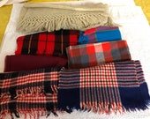 7 wool and wool blend scarves, plaids with fringe mostly neck scarves oblongs, 1 old very mended shawl fringed