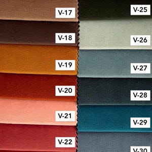 May include: A color chart titled Velvet Colors 2 displaying sixteen fabric swatches in two columns. The left column features shades from beige to deep red labeled V-16 through V-23. The right column shows green, grey, and blue tones labeled V-24 through V-31.
