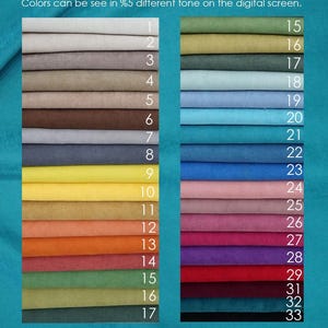 May include: A color swatch chart featuring two columns of stacked fabric samples in various hues, numbered 1 through 33. The text at the top reads: Colors can be seen in %5 different tone on the digital screen. The fabric has a soft texture.