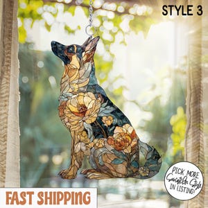 May include: A stained glass style suncatcher shaped like a German Shepherd dog, featuring a mosaic pattern of amber, brown, and blue floral designs. The piece includes a metal hanging ring and chain, with the text STYLE 3 in the upper corner.