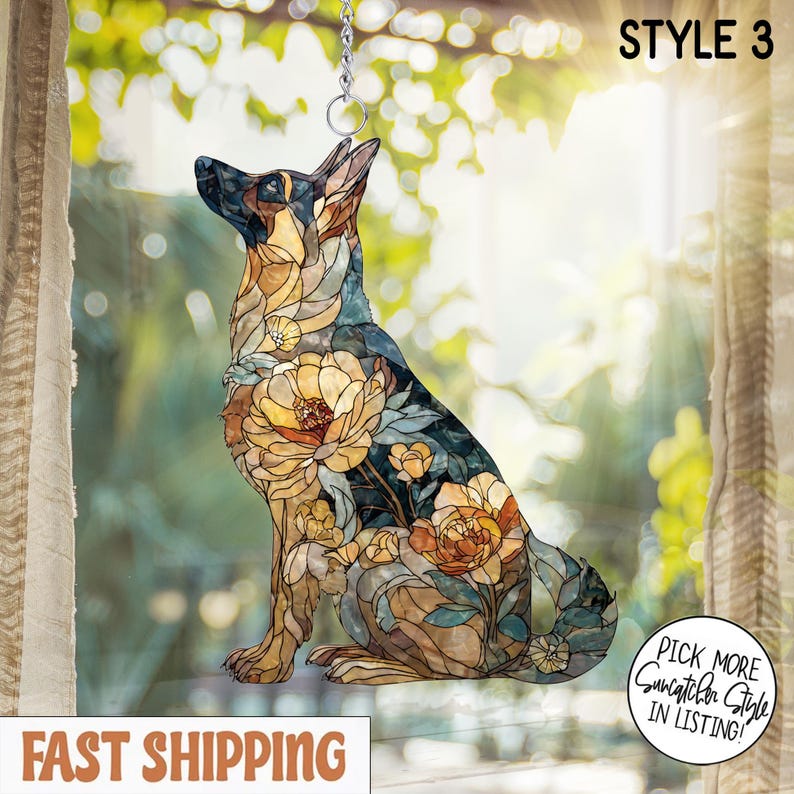 May include: A stained glass style suncatcher shaped like a German Shepherd dog, featuring a mosaic pattern of amber, brown, and blue floral designs. The piece includes a metal hanging ring and chain, with the text STYLE 3 in the upper corner.